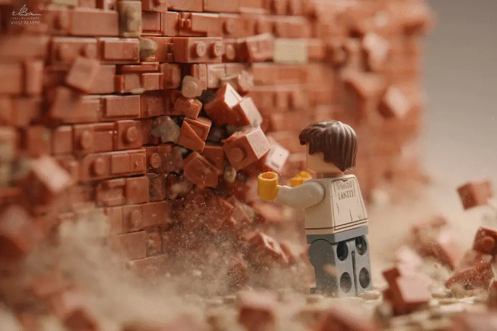 An avatar pulling a brick that crumbles a wall answering the FAQ on how to unblock people on Roblox An avatar pulling a brick that crumbles a wall answering the FAQ on how to unblock people on Roblox